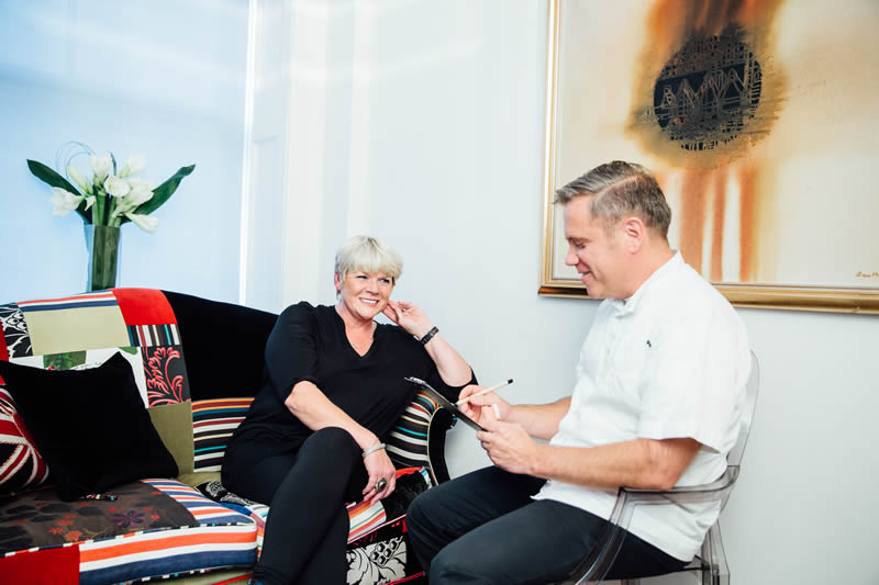 Dr Anthony Zybutz consulting with a client